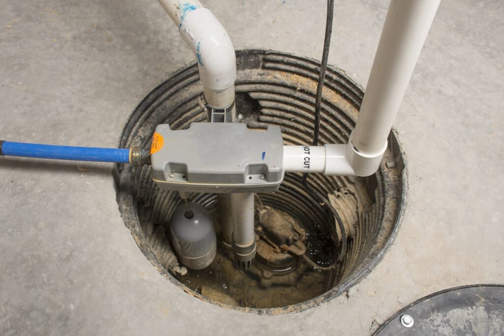What Repeated Sump Pit Sediment Buildup Says About Drainage Around the Home